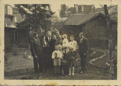 Family group in front of buildings